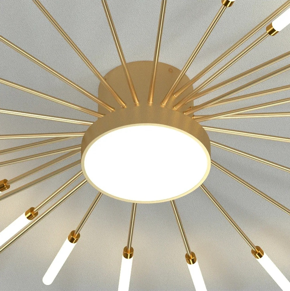 A modern gold ceiling light with a lot of lights on it, resembling a magical wand.