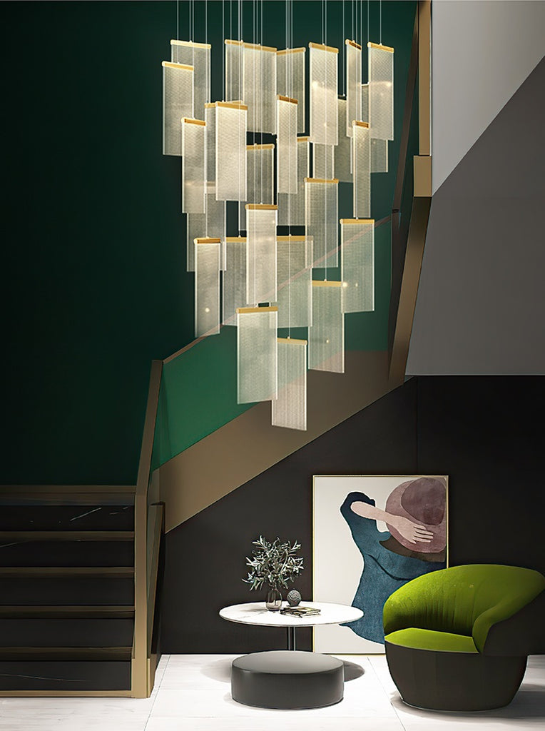 A luxury modern living room with green chairs and a Modern Villa Chandelier as the lighting solution.