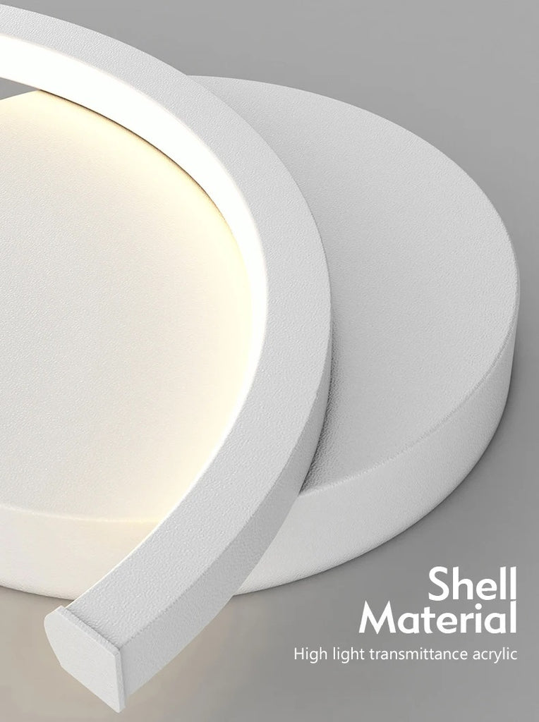 A close-up of white circular led light with the shell material that is perfect for illuminating a bedroom.