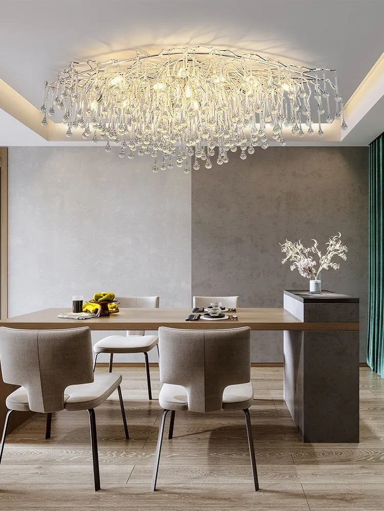 A luxurious dining room with a crystal chandelier.