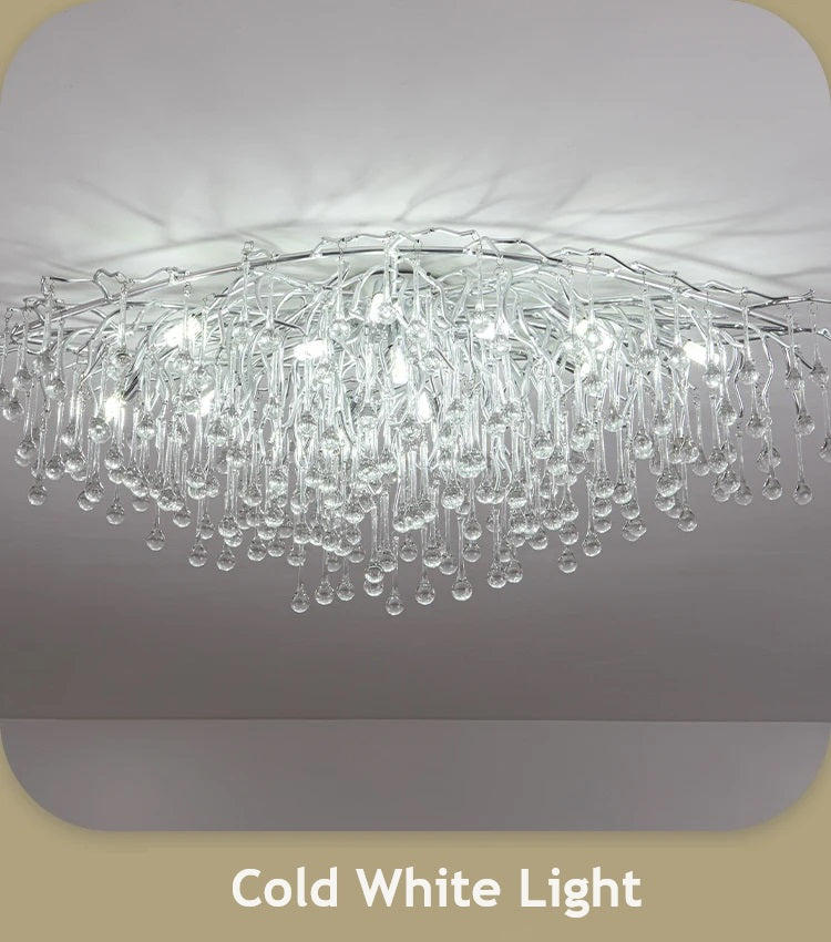 Luxurious chandelier with cold white light and crystals.