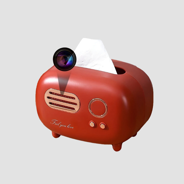 A red, vintage-style tissue box holder designed to resemble a retro toaster with a hidden security feature: a Tissue Box SpyCam, allowing for discreet surveillance tactics.