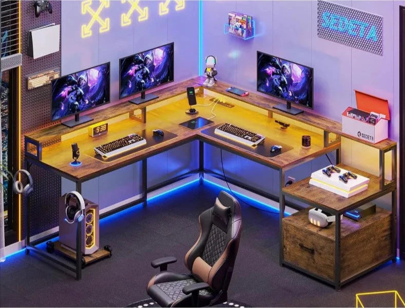 A modern gaming setup with multiple monitors, LED lighting, and a coordinating gaming desk.