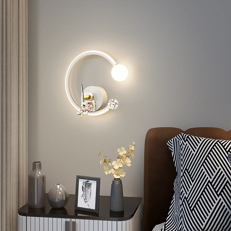 Modern Wall-mounted Star Astronaut Light with a circular design next to a cozy sitting area, evoking celestial wonder with decorative items on a sideboard.