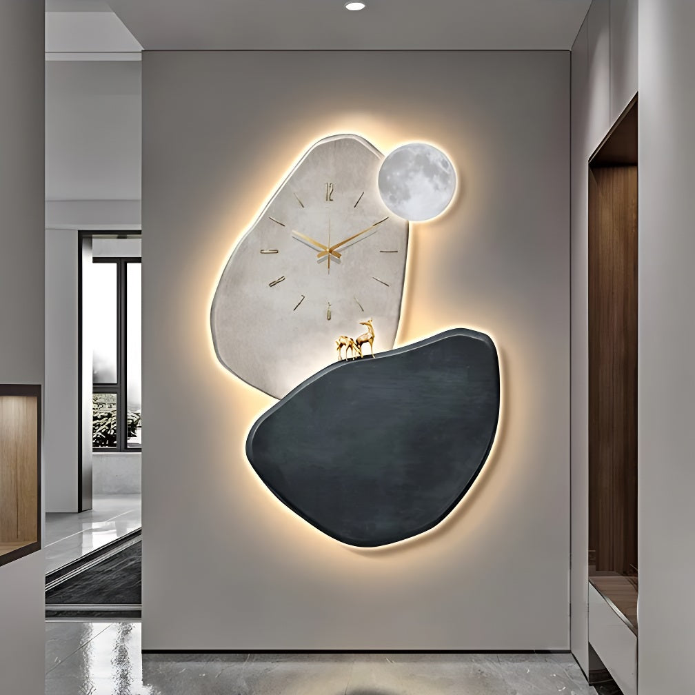 A stylish wall clock in a hallway with a moon on it.