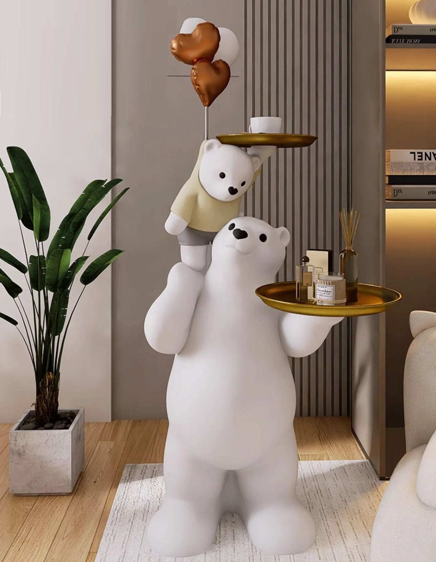 Decorative sculpture of two polar bears in a living room, the larger one holding a tray while the smaller bear atop its shoulders holds a heart-shaped balloon.