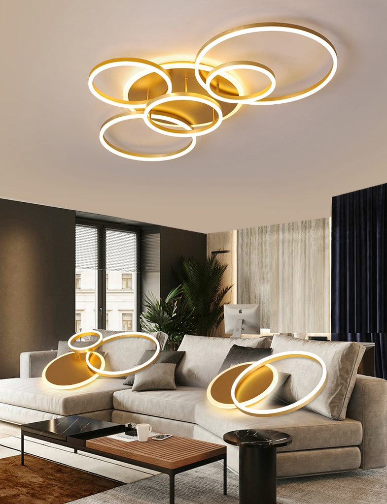 A contemporary living room with an interlocking rings ceiling lamp.