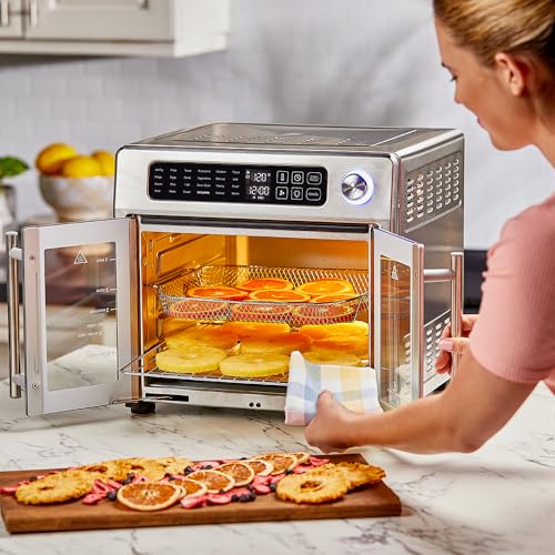 A woman is using an air fryer to cook healthier meals.