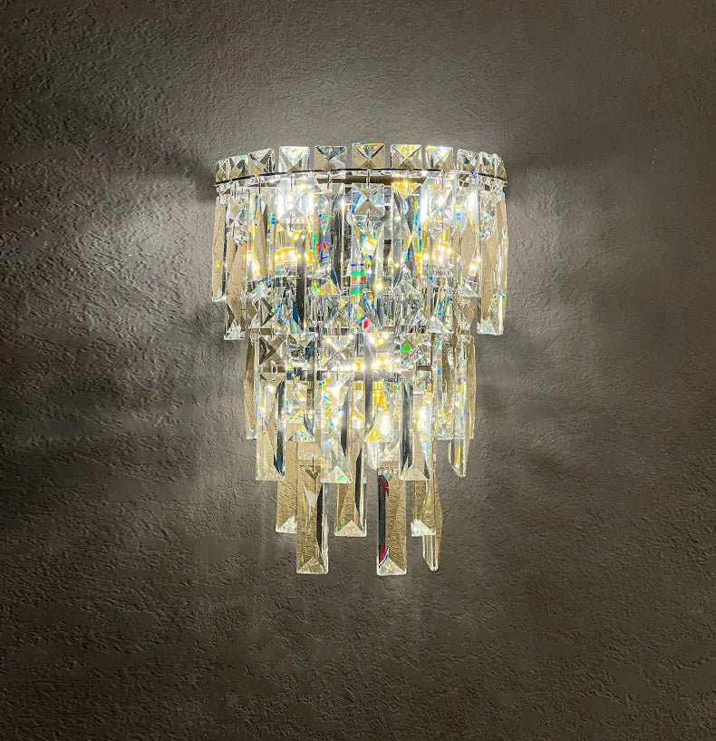 A luxury crystal wall sconce hanging on a wall, perfect for sophisticated living areas.