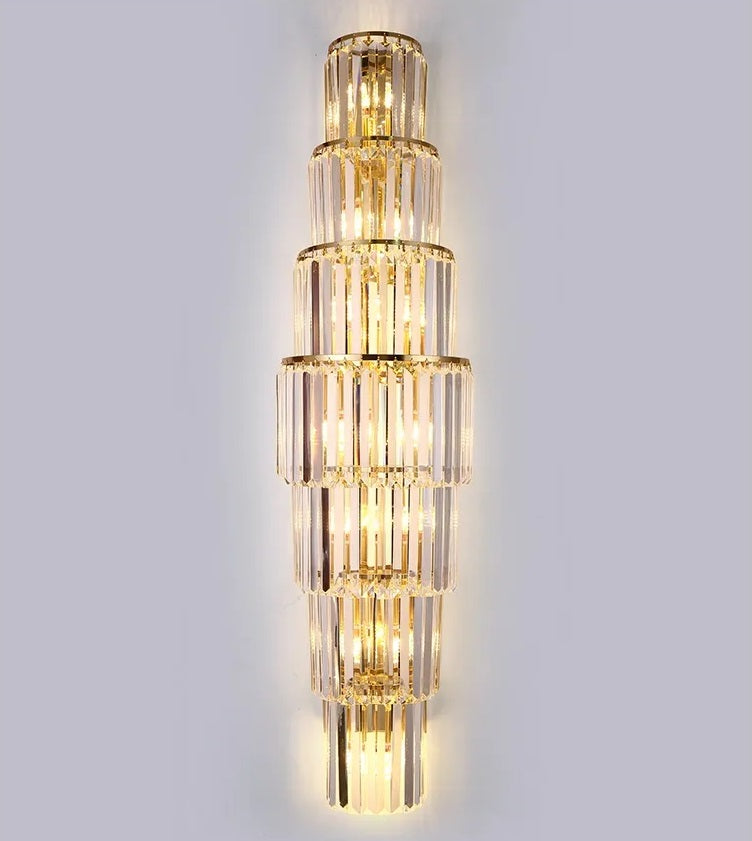 A sparkling gold and glass wall light sconce adorned with crystal accents.
