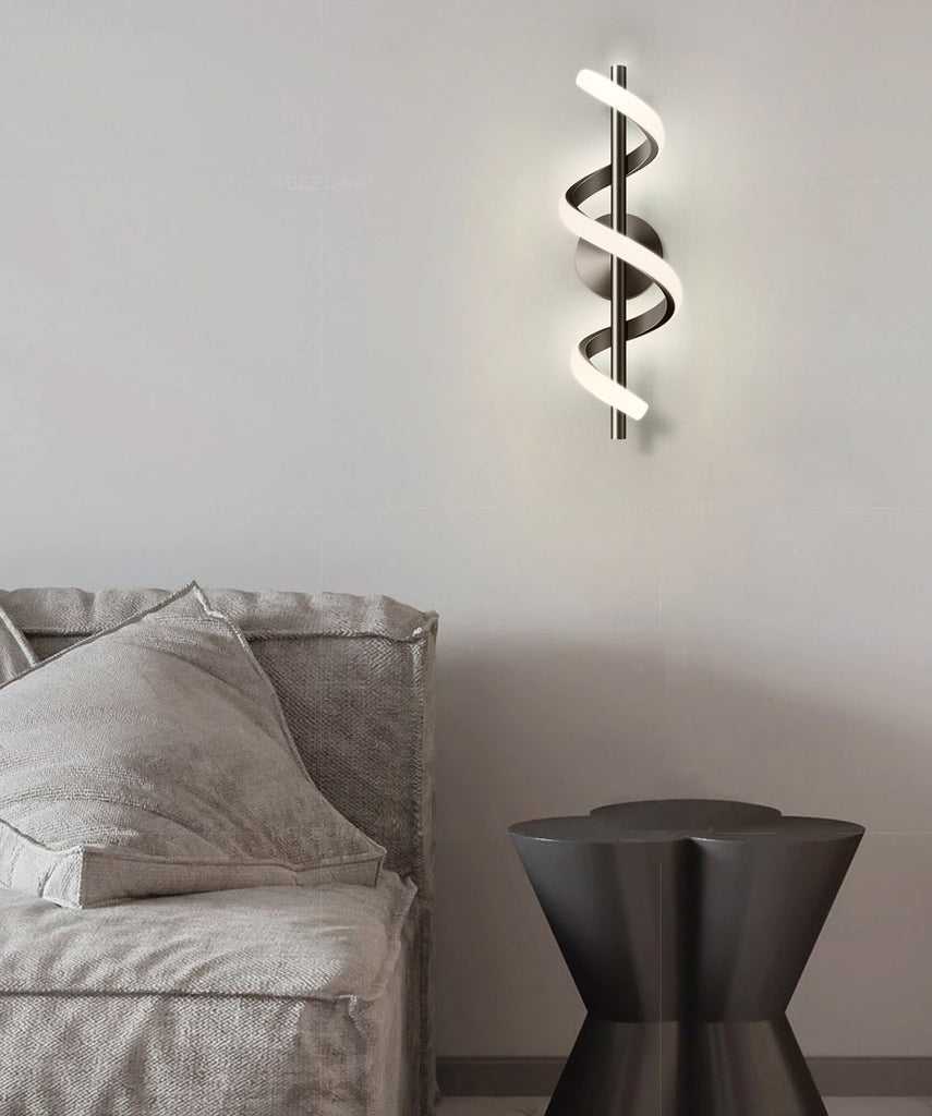 A modern living room with a Nordic elegance, featuring a couch and a Spiral Wall Lamp on the walls.