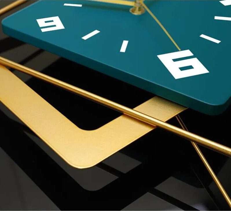 A modern, minimalist blue and gold clock sitting on top of a table.