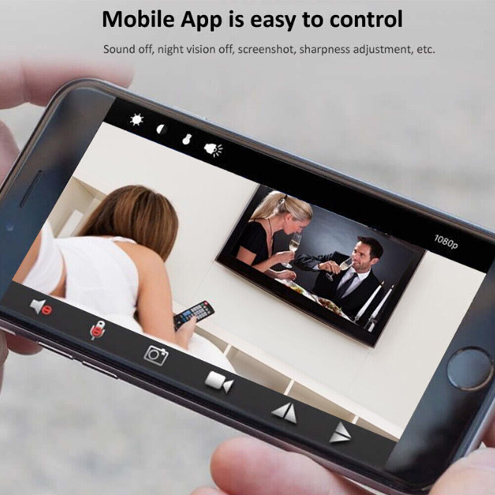 Smartphone screen displaying a mobile app interface for controlling a SpyCam Charger Hub, showing a live video feed of a man and woman dining.