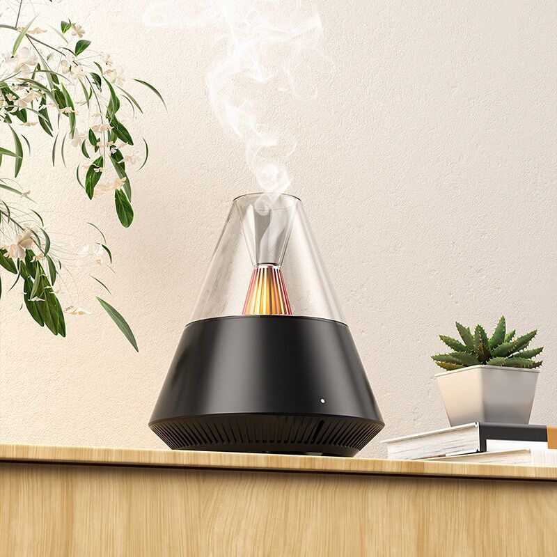 Aromatherapy diffuser releasing vapor on a wooden shelf against a beige wall, with plants in the background, is not just any essential oil diffuser but also a SpyCam.