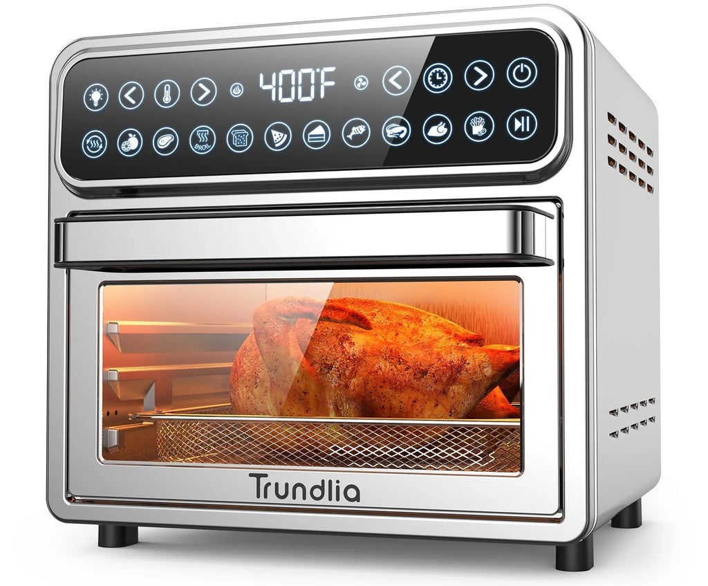 A stainless steel toaster oven cooking a healthy chicken.