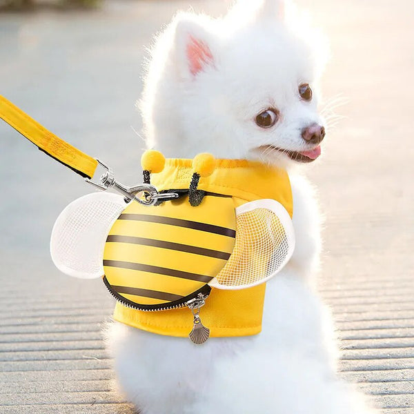 A furry friend dog wearing a yellow vest with a bee on it.