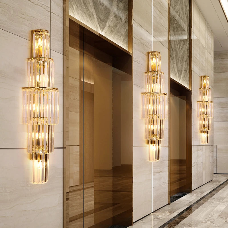 A modern lobby with a large number of crystal chandeliers hanging from the wall.