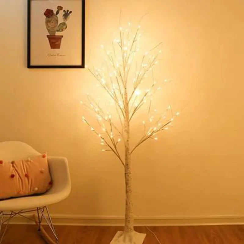 A lifelike Magic Birch Tree with enchanting ambiance, adorned with white lights, stands beautifully in the corner of a room.