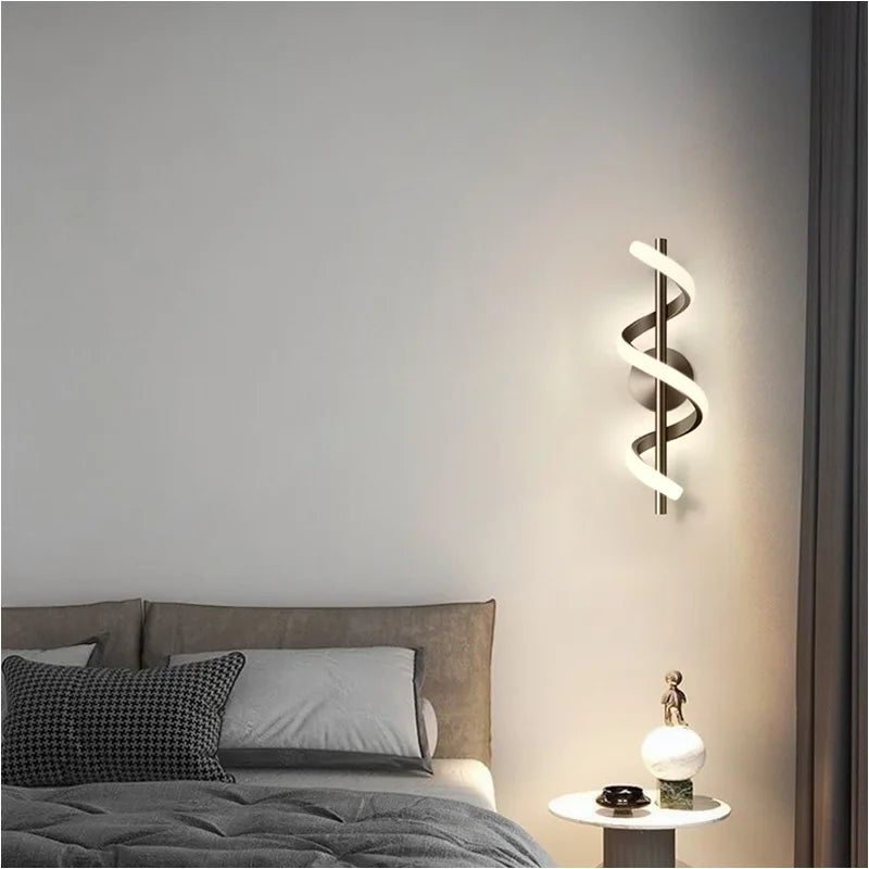 A bedroom with a bed and a Nordic elegance-inspired Spiral Wall Lamp.