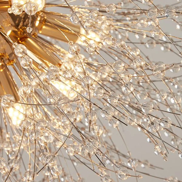 A modernized and enchanted close up of a gold and crystal chandelier.