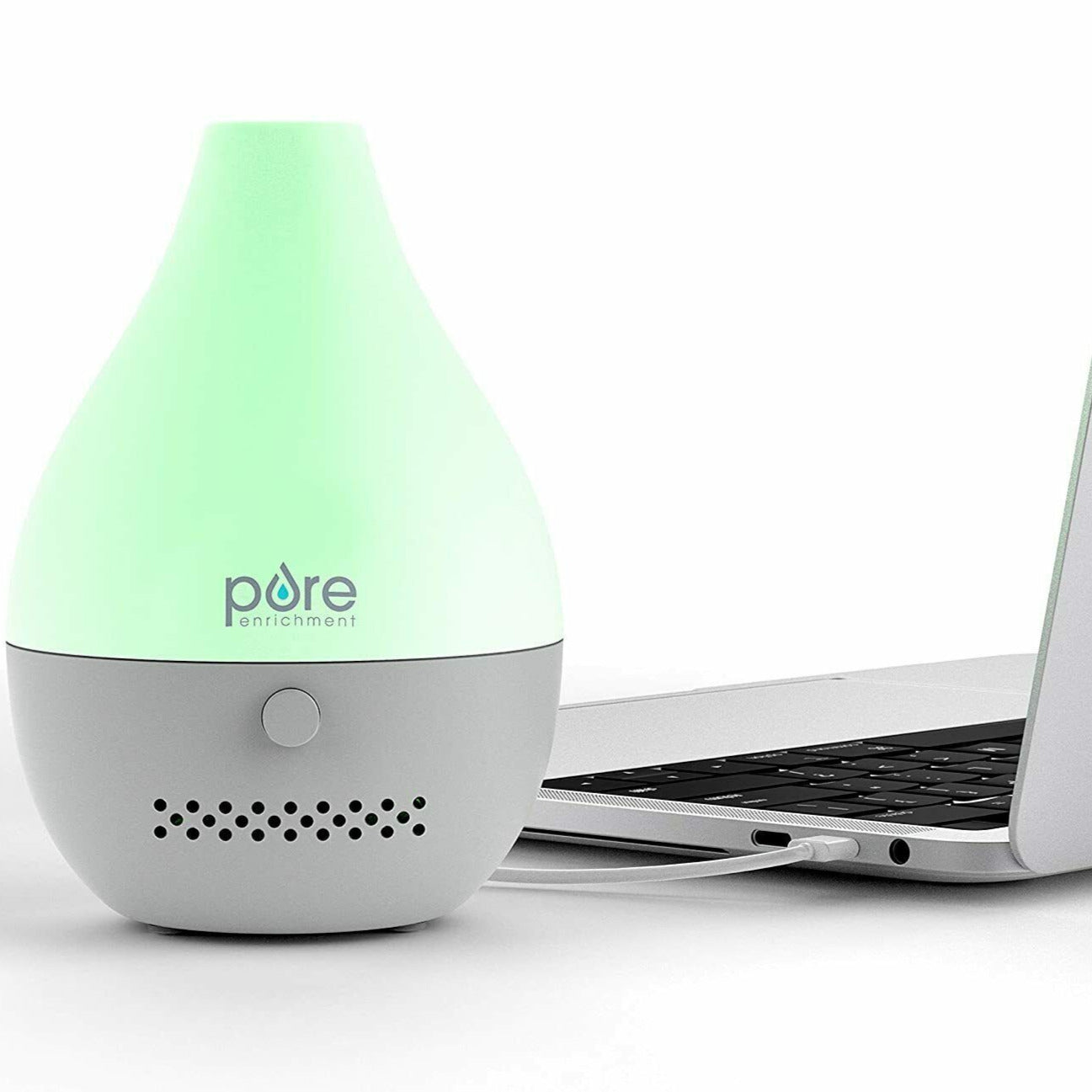 USB-powered ultrasonic oil diffuser next to a laptop with a hidden WiFi camera.