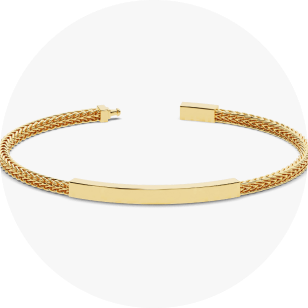 Eternate's yellow gold fox tail chain bracelet for men in front of white background