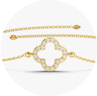 Eternate's yellow gold diamond clover bracelet in front of white background