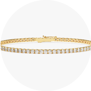 Eternate's yellow gold tennis bracelet in front of white background
