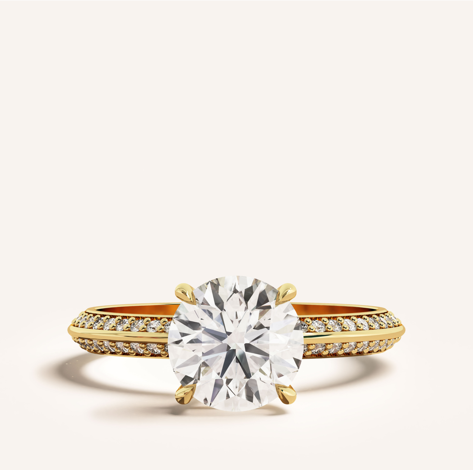 yellow gold round solitaire engagement ring with sidestones