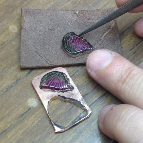 Close up on a goldsmith working on a new tourmaline Butterfly jewel