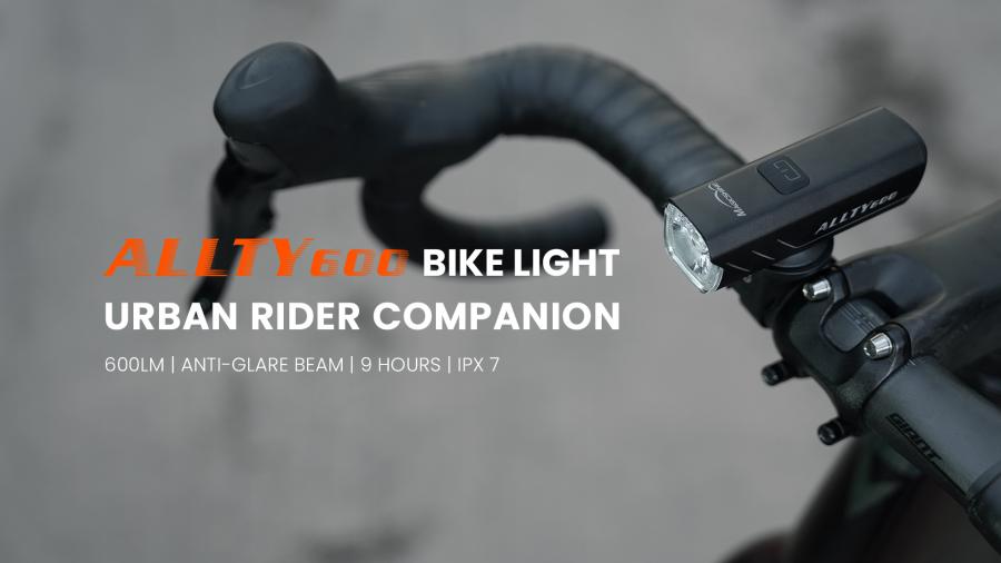 Magicshine ALLTY 600V2.0 bike light mounted on bicycle handlebars, with text indicating its 600LM output, anti-glare beam, 9 hours runtime, and IPX7 waterproof rating, presented as an urban rider companion.