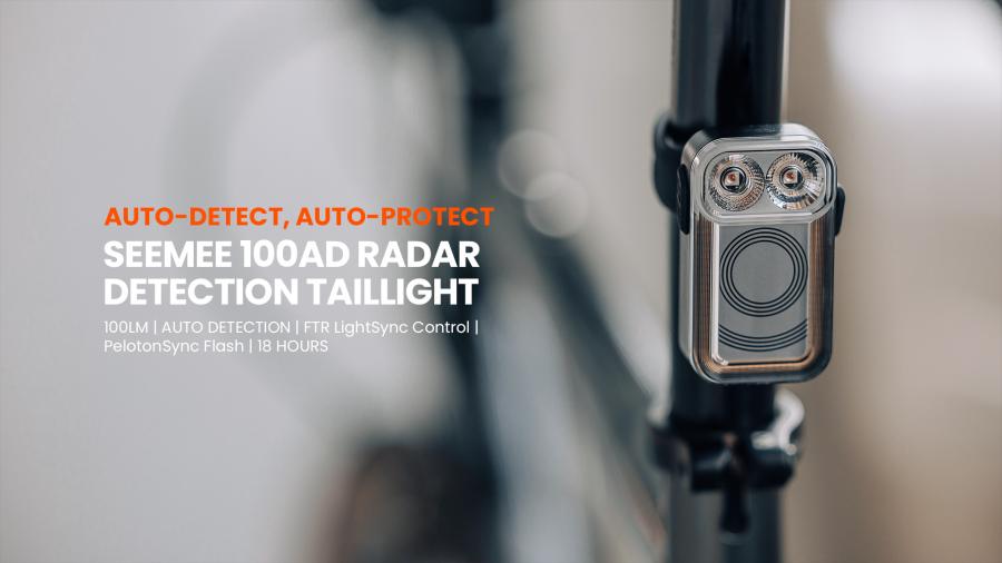 Close-up of the Magicshine SEEMEE 100AD Radar Rear Light glowing bright red, securely mounted on a bicycle seat post, emphasizing its powerful illumination for cyclist safety.