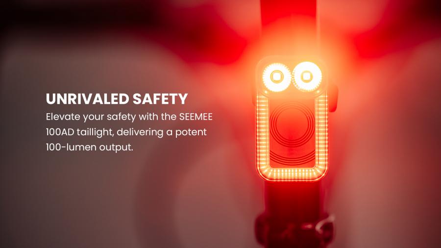 Magicshine SEEMEE 100AD Radar Detection Tail Light mounted on a bike, highlighting its 'Auto-Detect, Auto-Protect' capabilities, 100 lumens, auto detection, FTR LightSync Control, PelotonSync Flash, and 18-hour runtime for comprehensive cycling safety.