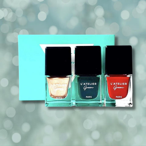 a picture of three of the L'Atelier Green Paris nail polishes and their box packaging