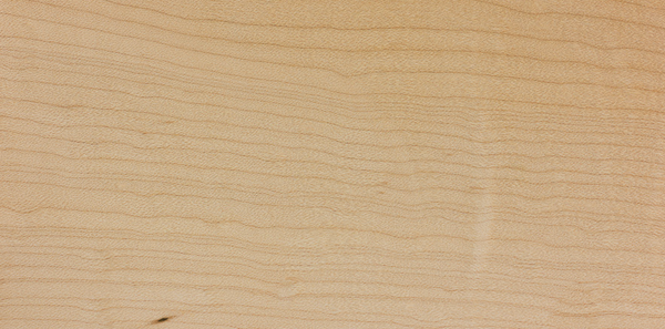 Close-up image showcasing the natural color and grain pattern of Hard Maple wood: Featuring a light, creamy hue with a fine, uniform grain for a timeless and elegant appearance