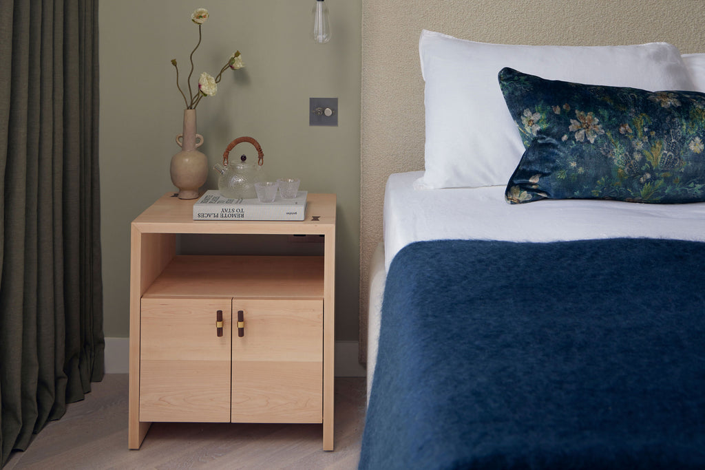 Lifestyle image of an earthy bedroom in One Crown Place Development, showcasing a bespoke Maple bedside cabinet crafted by Martelo and Mo: Adding warmth and sophistication to the tranquil bedroom setting.