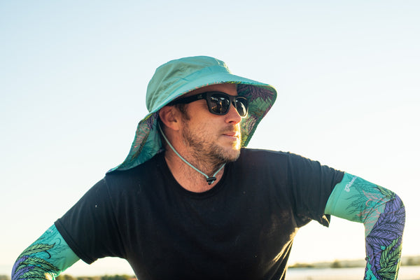 A man wearing a protective gardening outfit.