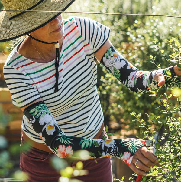 Gardener in the field wearing sleeves.