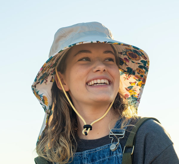 Woman wearing the new sun hat from Farmers Defense.