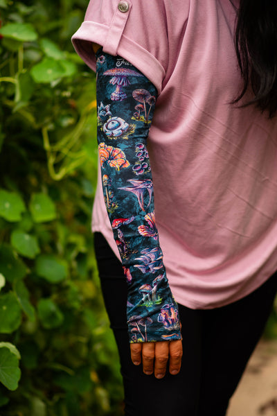 A woman wearing her favorite sleeves in the garden.