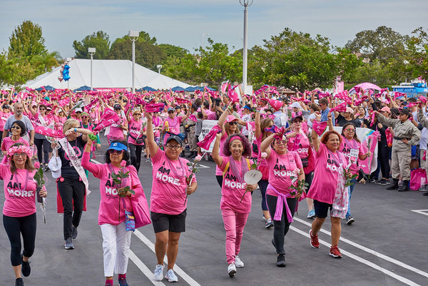 Women marching to defeat breast cancer.
