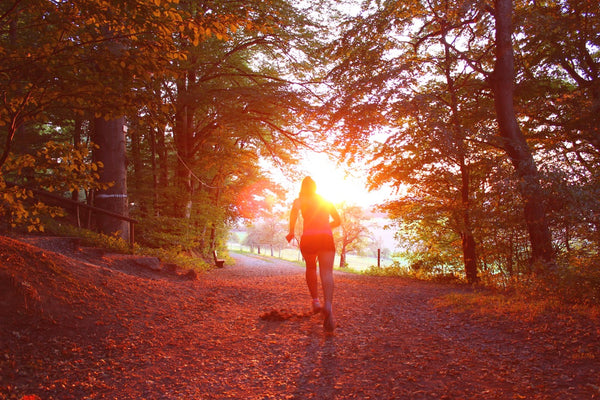 A woman running in the sunset. 