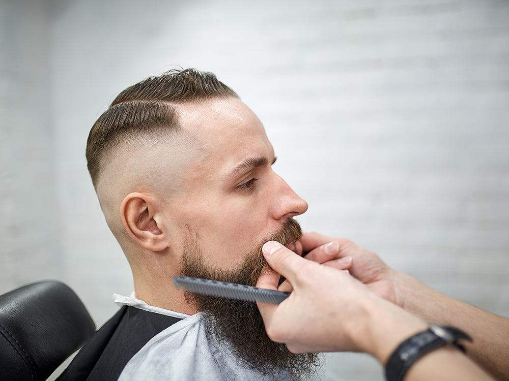 Barber waxing moustache, Beard PANS Ltd