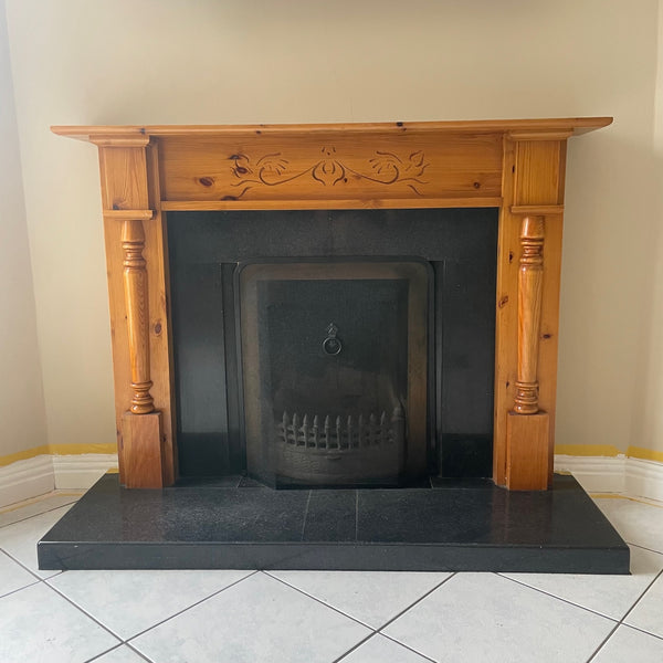 Before and after painting a wood and marble fireplace.