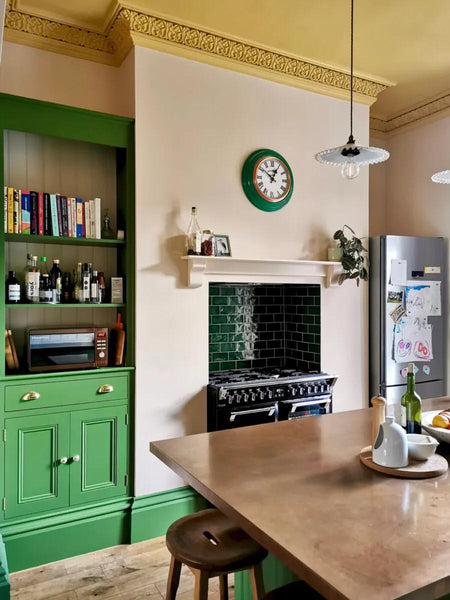 Little Greene Hopper on all of the woodwork and kitchen cabinets. Little Greene Light Beauvais on the walls. Paint and Paper Library Parasol on the ceiling and cornice.