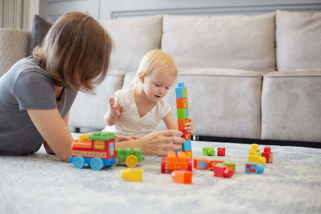 Baby and Mom playing on play mat