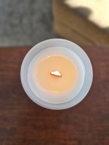 Candle lit and melted to the same area as the shorter burn time