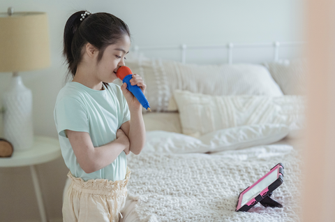 girl singing karaoke