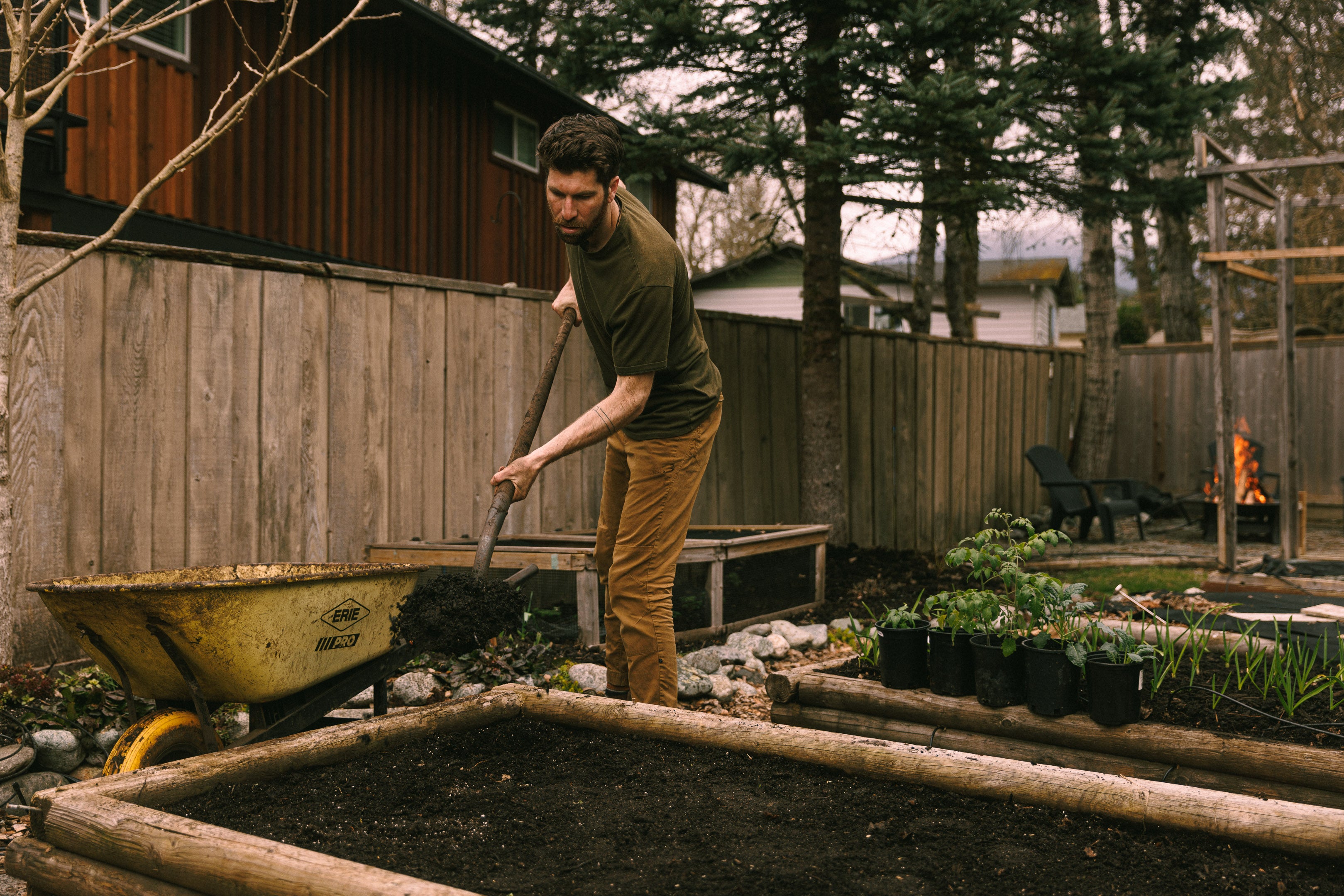 Applying compost across the entirety of a garden bed
