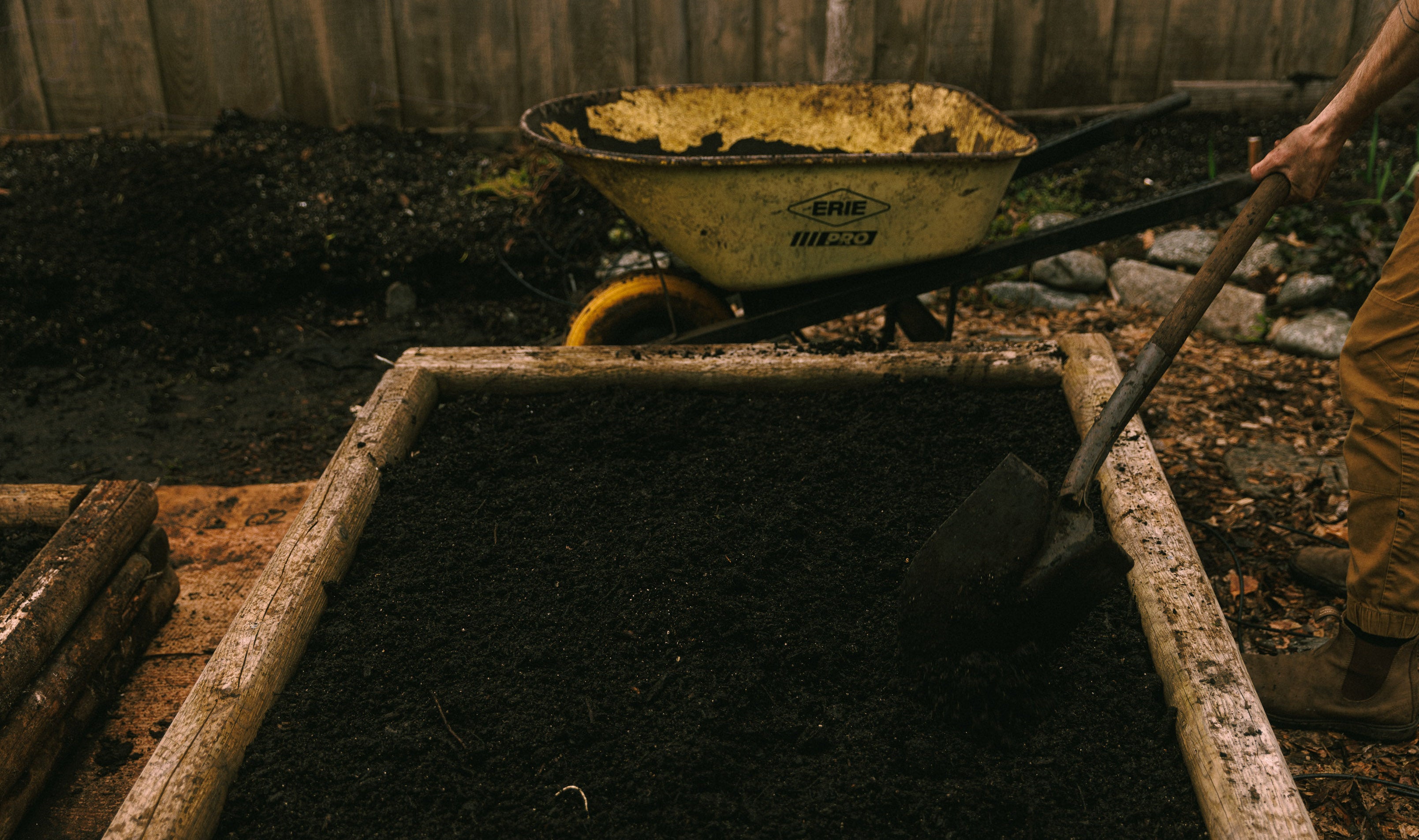 fresh compost applied across a raised garden bed